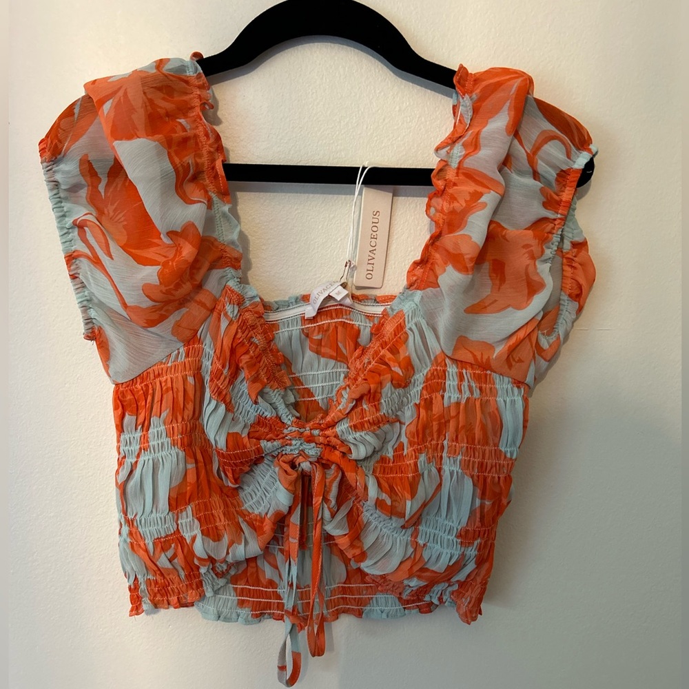 From a small nice boutique in my town named alexandera blue. A very nice top